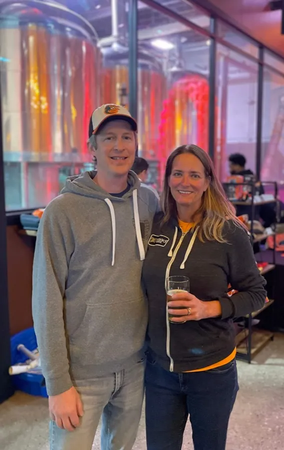Rob and Judy Neff standing together in front of the Checkerspot brewhouse