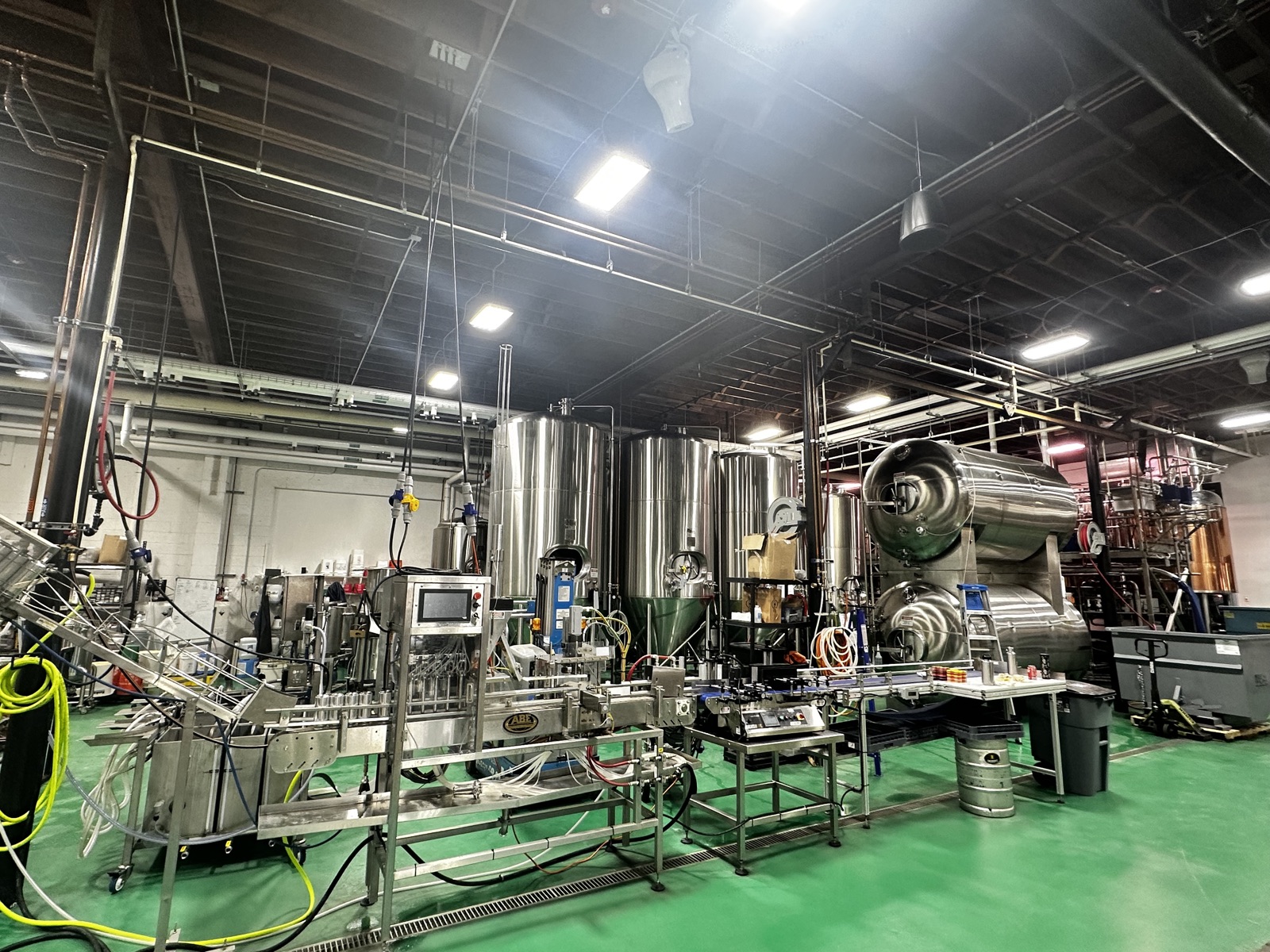 Fermentation tanks and the canning line in the Checkerspot brewhouse