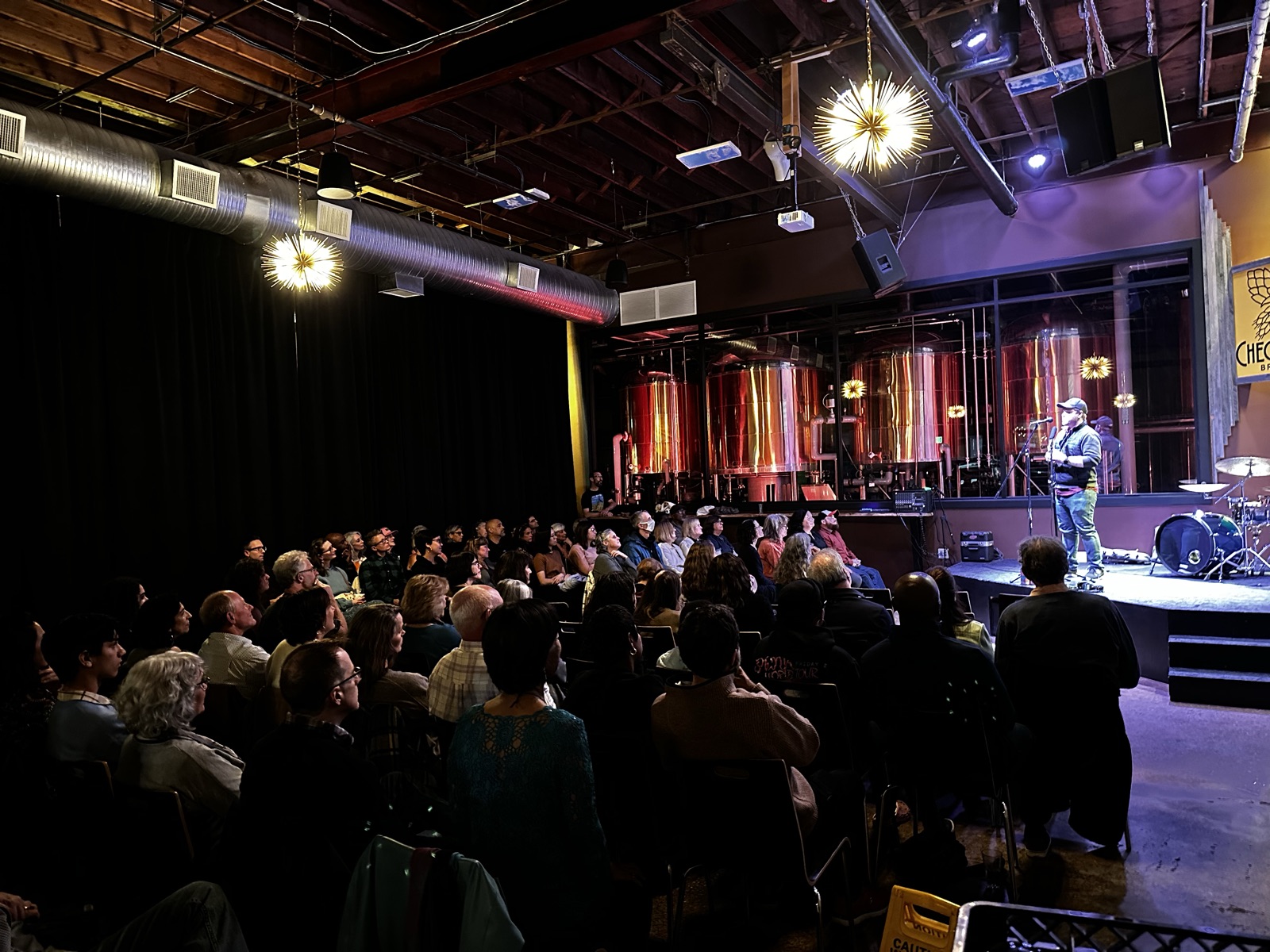 A full house watching a show on the Checkerspot stage